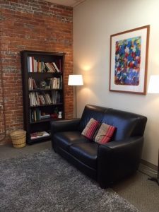 island therapy office couch and bookshelf